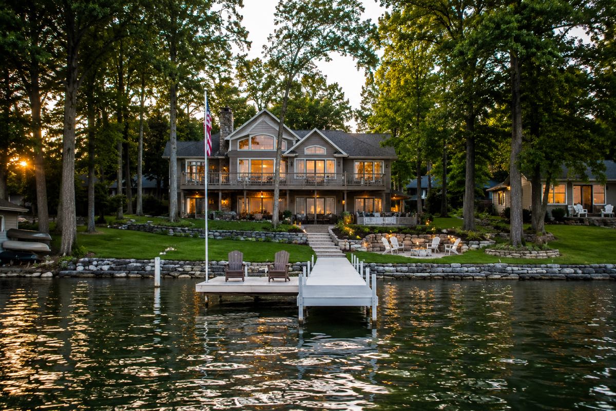 Minnesota lakefront estate at dusk seen from the water