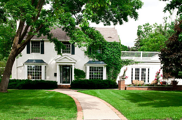 White colonial Minnesota home with ivy-covered walls